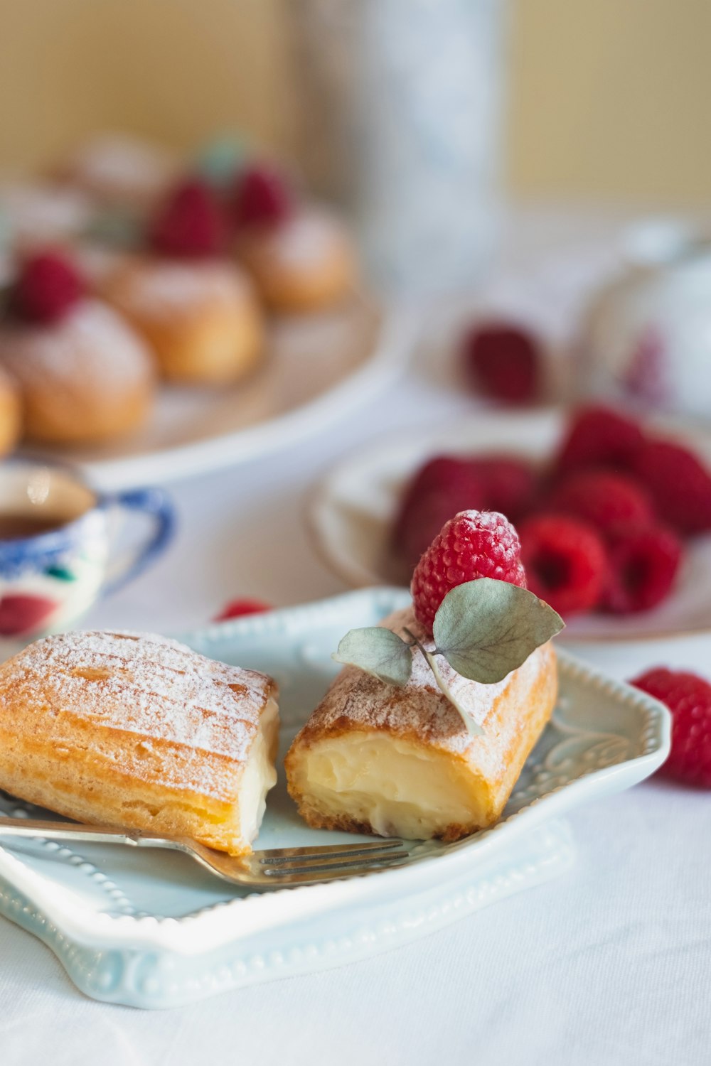 sliced cake with strawberry on white ceramic plate