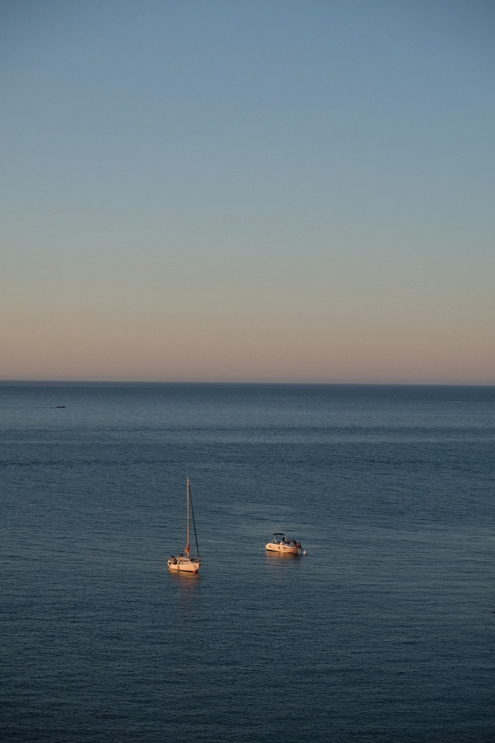 white and brown boat on sea during daytime