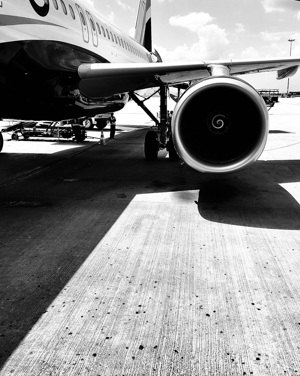 grayscale photo of airplane on airport