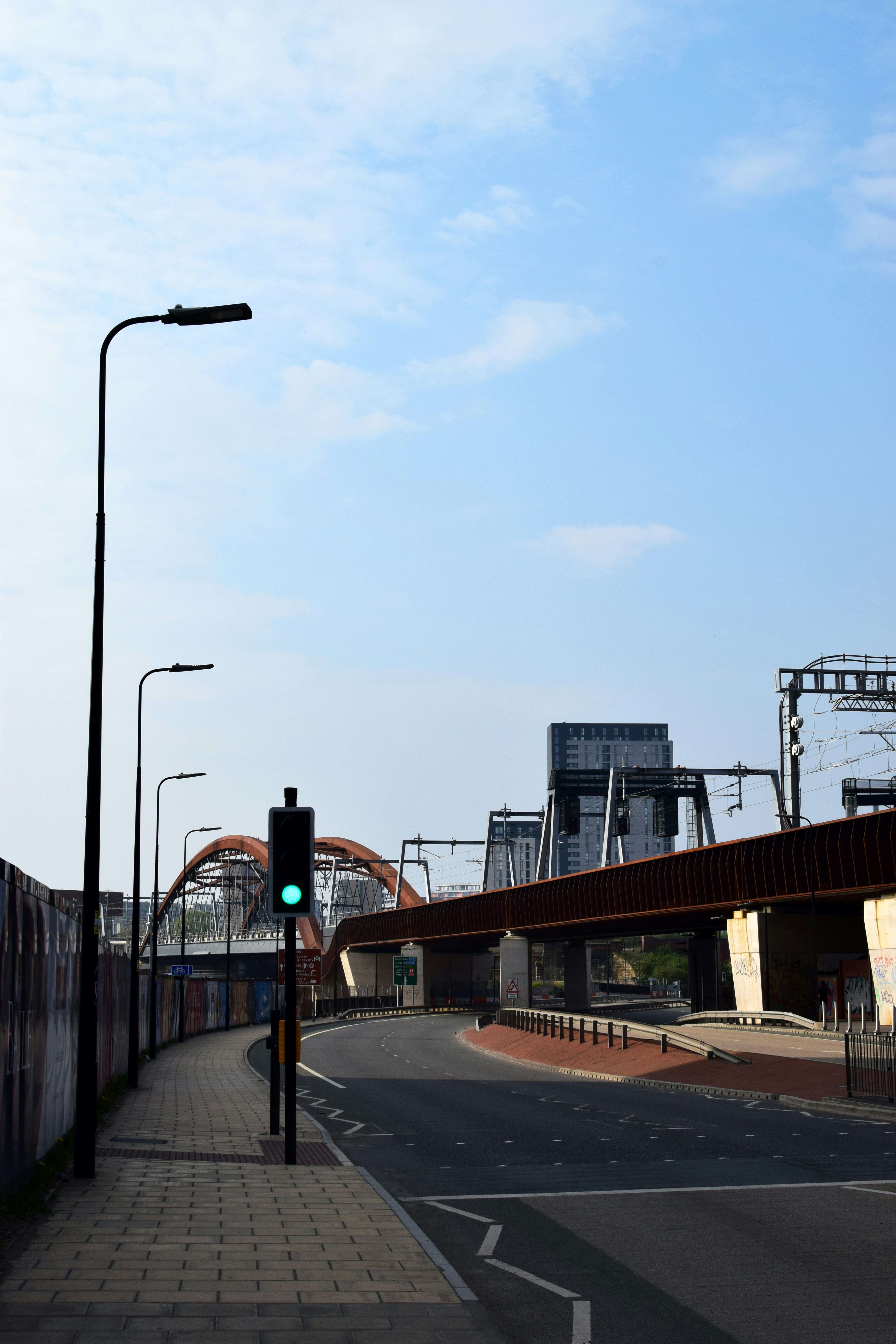 black metal bridge under white sky during daytime