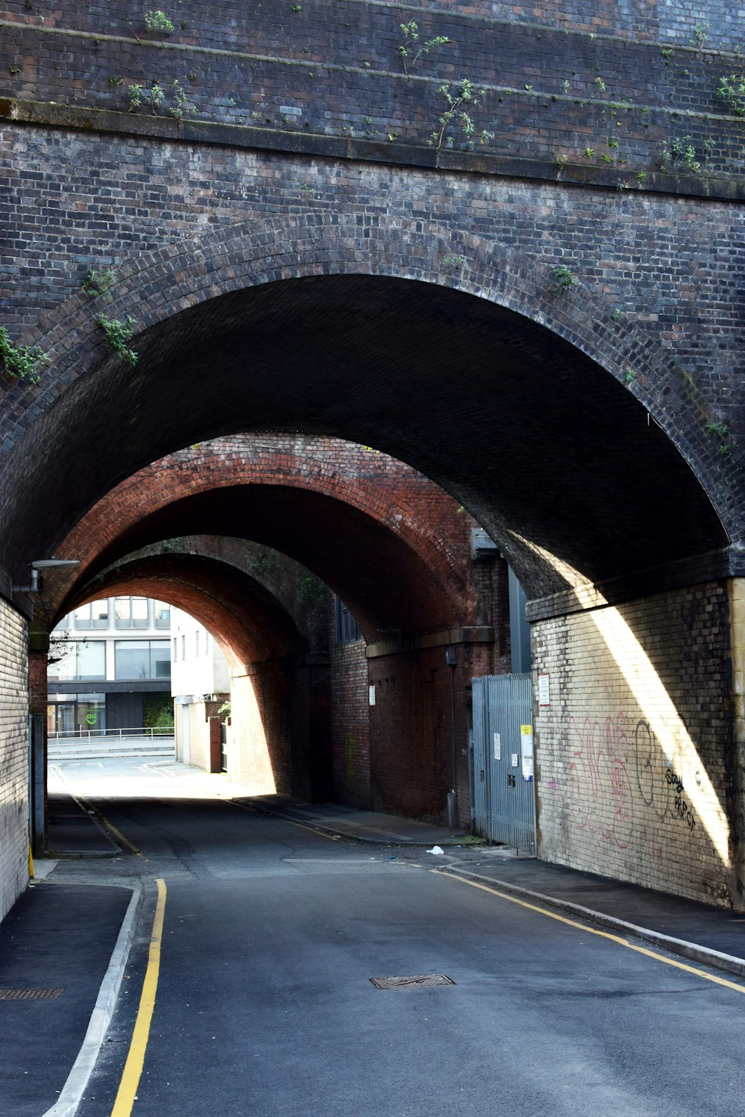 brown brick tunnel during daytime