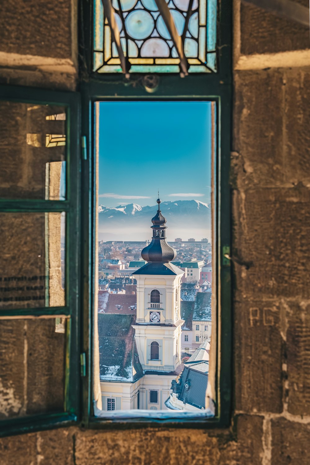 blue wooden framed glass window