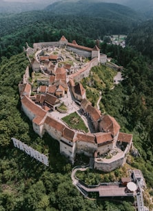 aerial view of brown and white houses on mountain during daytime