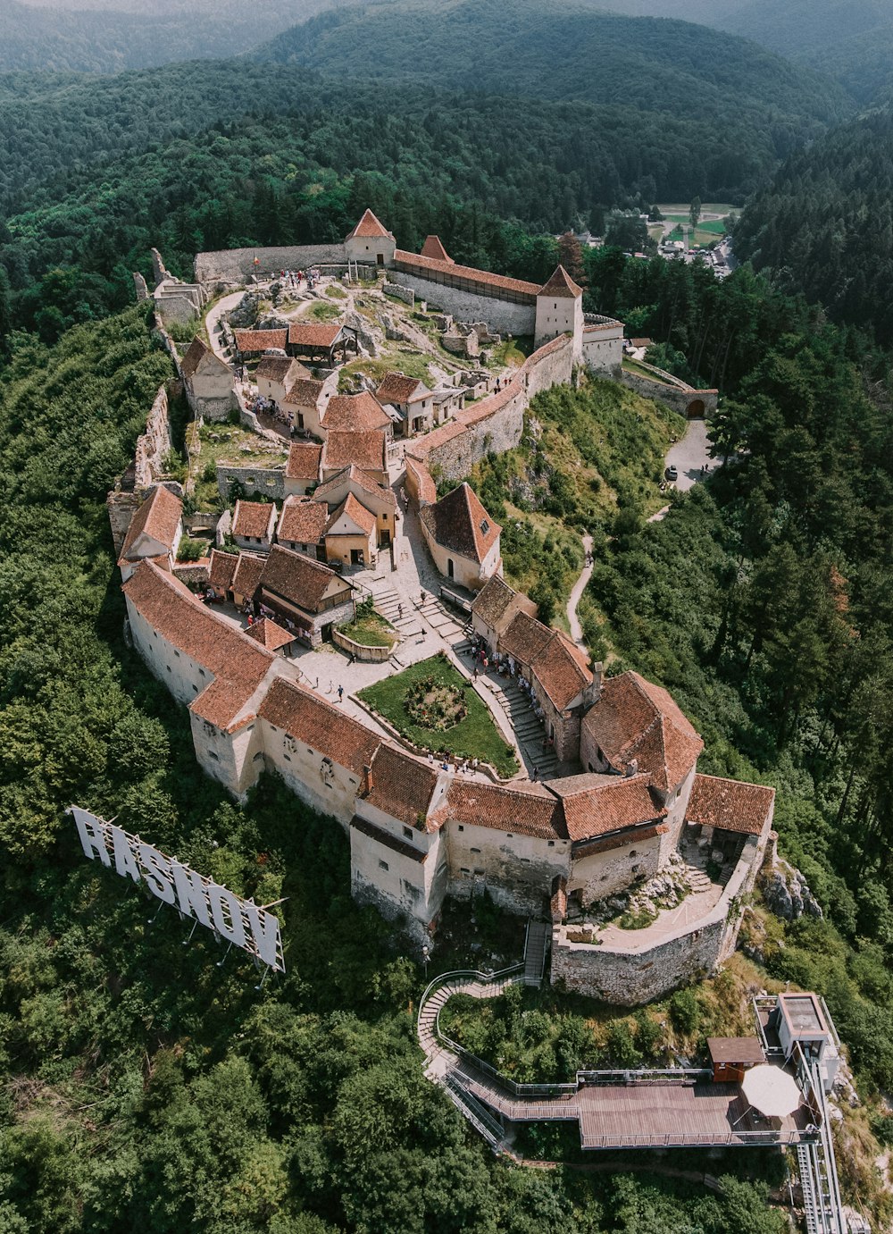 aerial view of brown and white houses on mountain during daytime