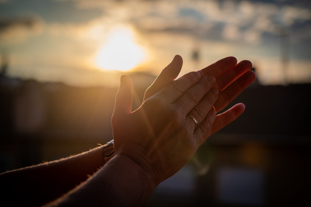 persons left hand with silver ring