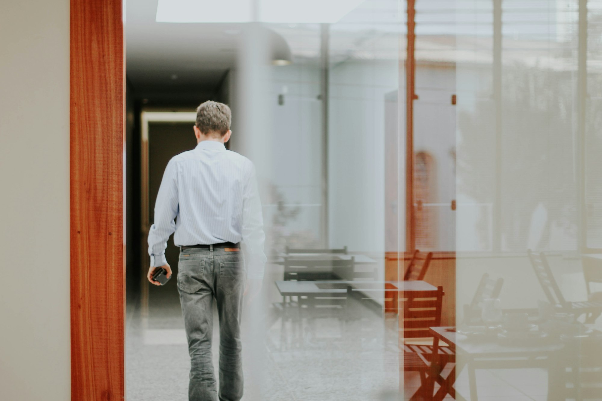 Man walking towards the opposite direction. Leaving.