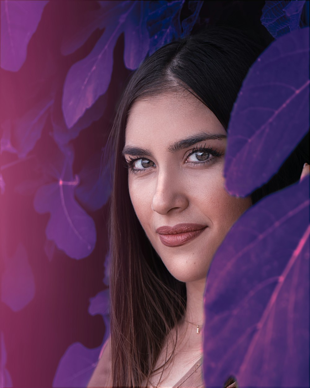 woman with purple leaves on her head