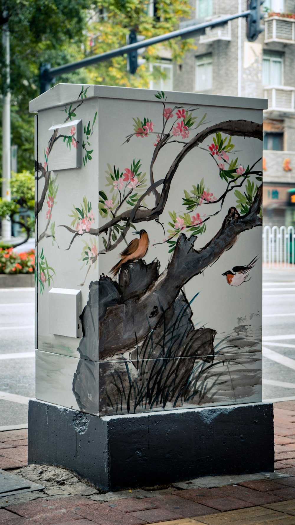 a box with a painting of a bird on it