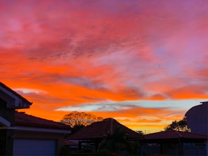 A vibrant orange sunset over Córdoba’s historic rooftops.