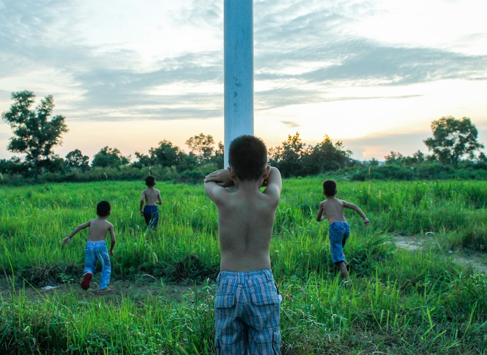 a group of young men playing a game of frisbee