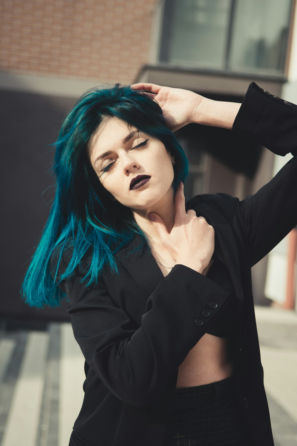 woman in black blazer with blue hair