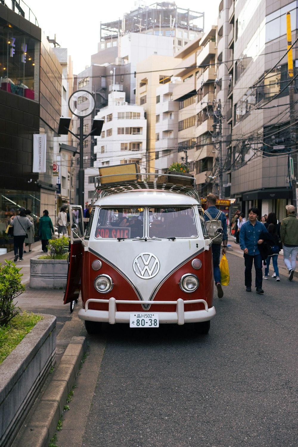 red and white volkswagen t-2 van on road during daytime