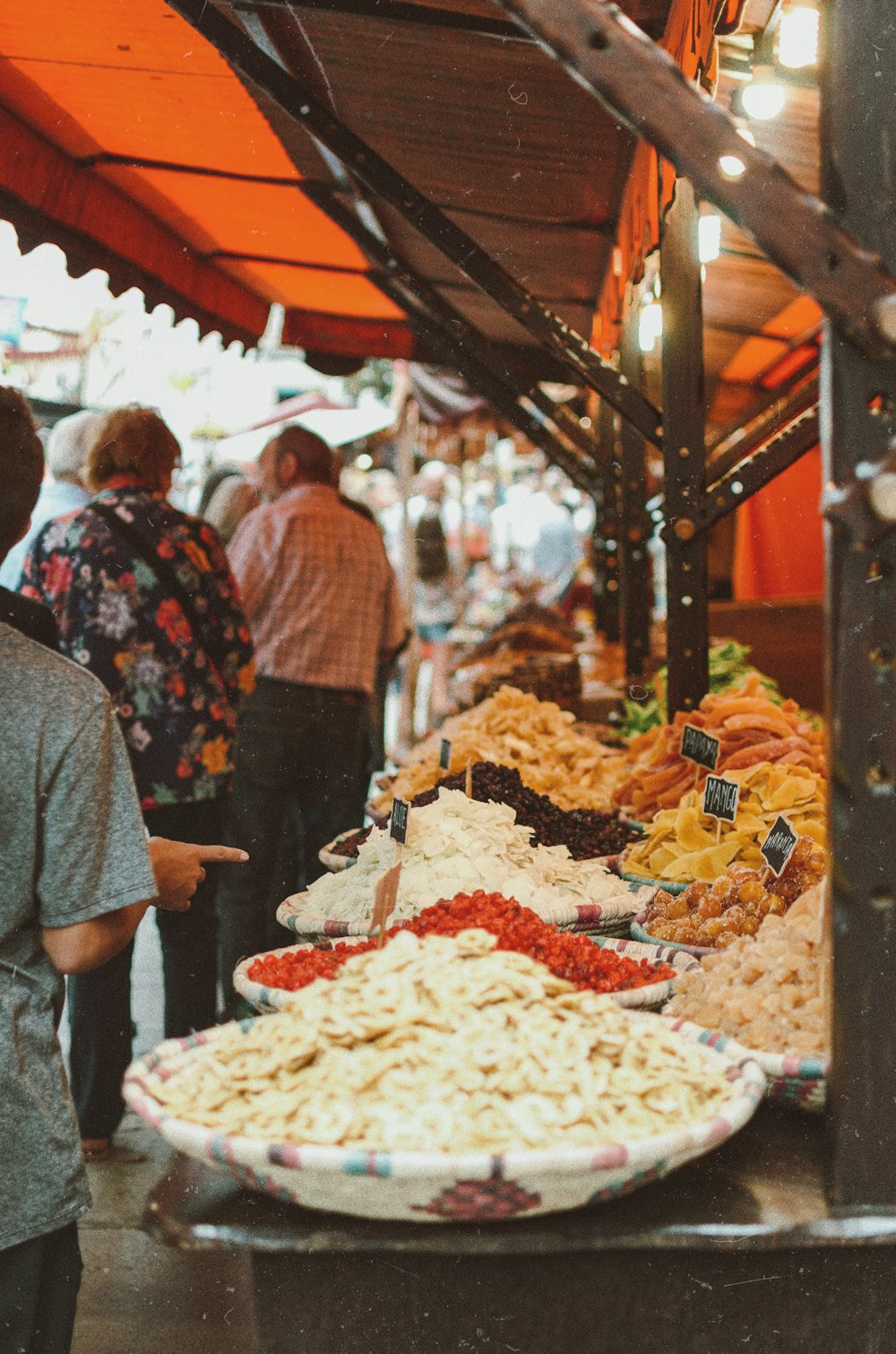 people standing in front of food display