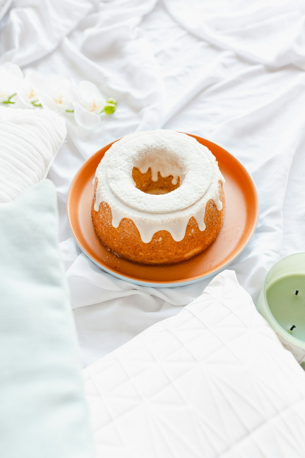 brown and white donut on brown round plate