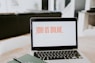 macbook pro on brown wooden table