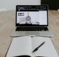 macbook pro on brown wooden table