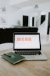 macbook pro on brown wooden table