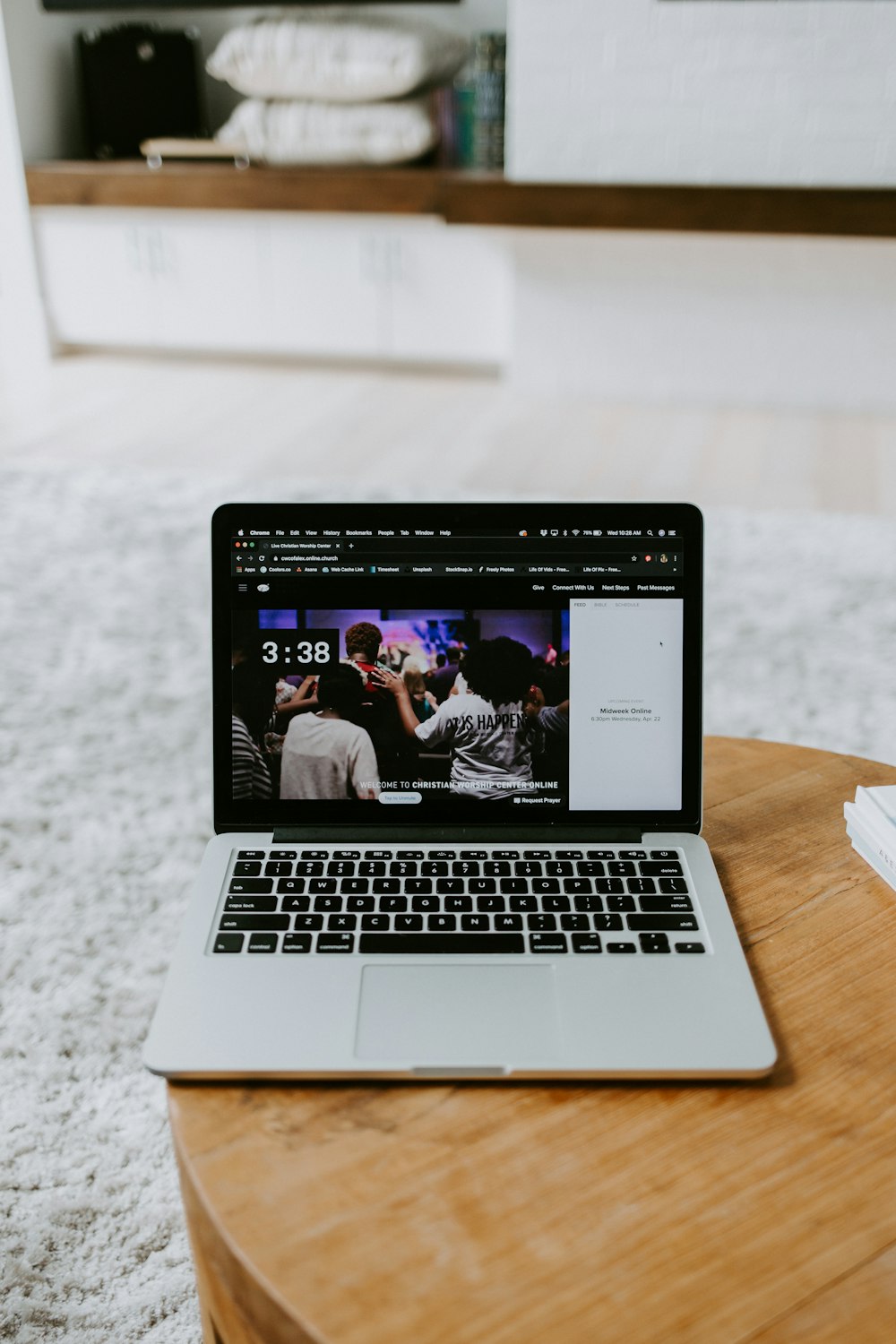 macbook pro on brown wooden table