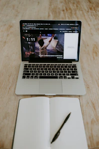 macbook pro on brown wooden table