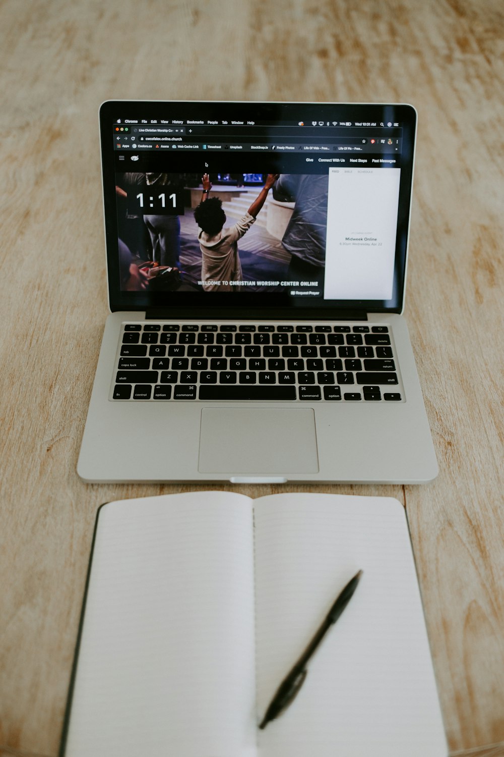 macbook pro on brown wooden table