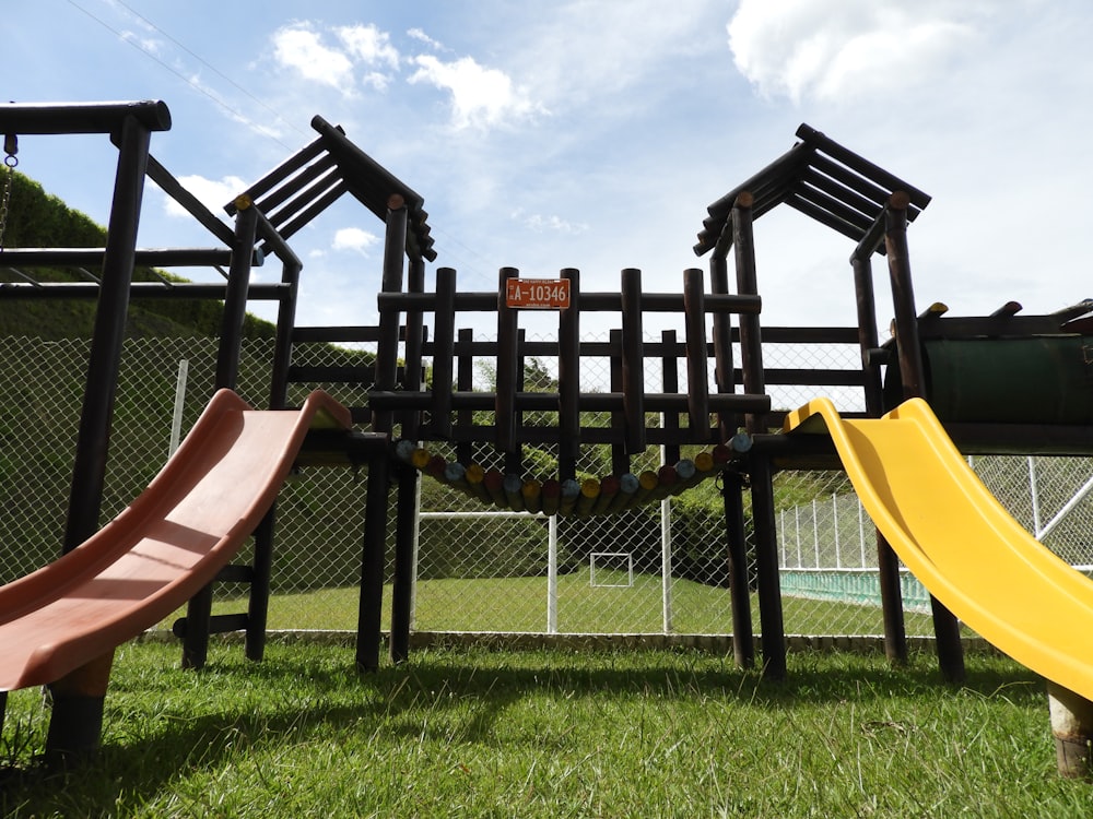 black wooden chairs on green grass field during daytime