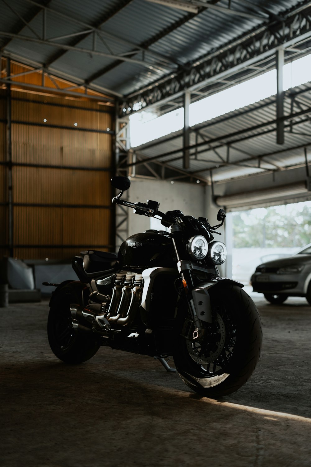 black and gray motorcycle parked in garage