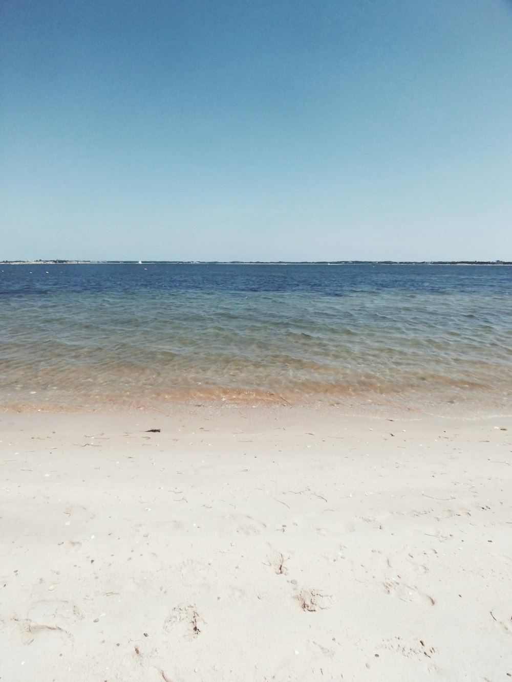 blue sea under blue sky during daytime