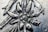 A close-up view of an intricate metal engraving depicting a floral pattern with detailed textures. The image highlights the craftsmanship involved in creating the piece.
