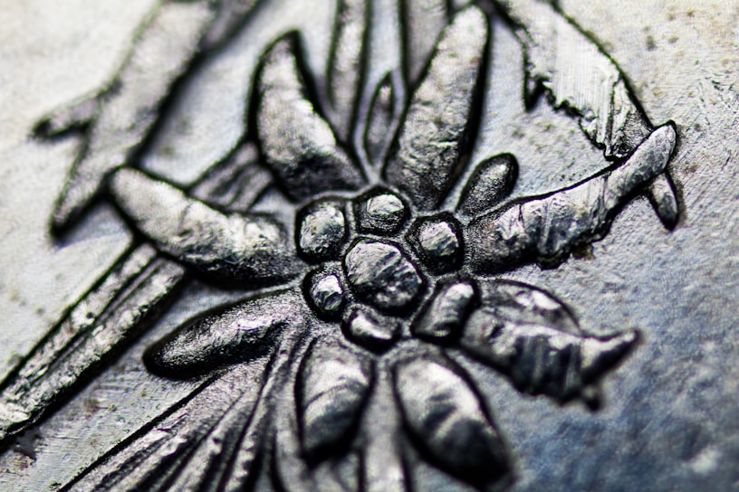 Close-up of a wooden plaque with intricate laser engraving details.