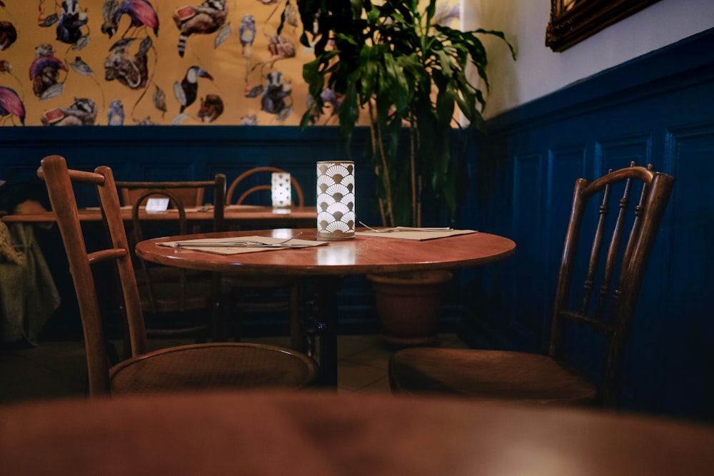 brown wooden round table with chairs