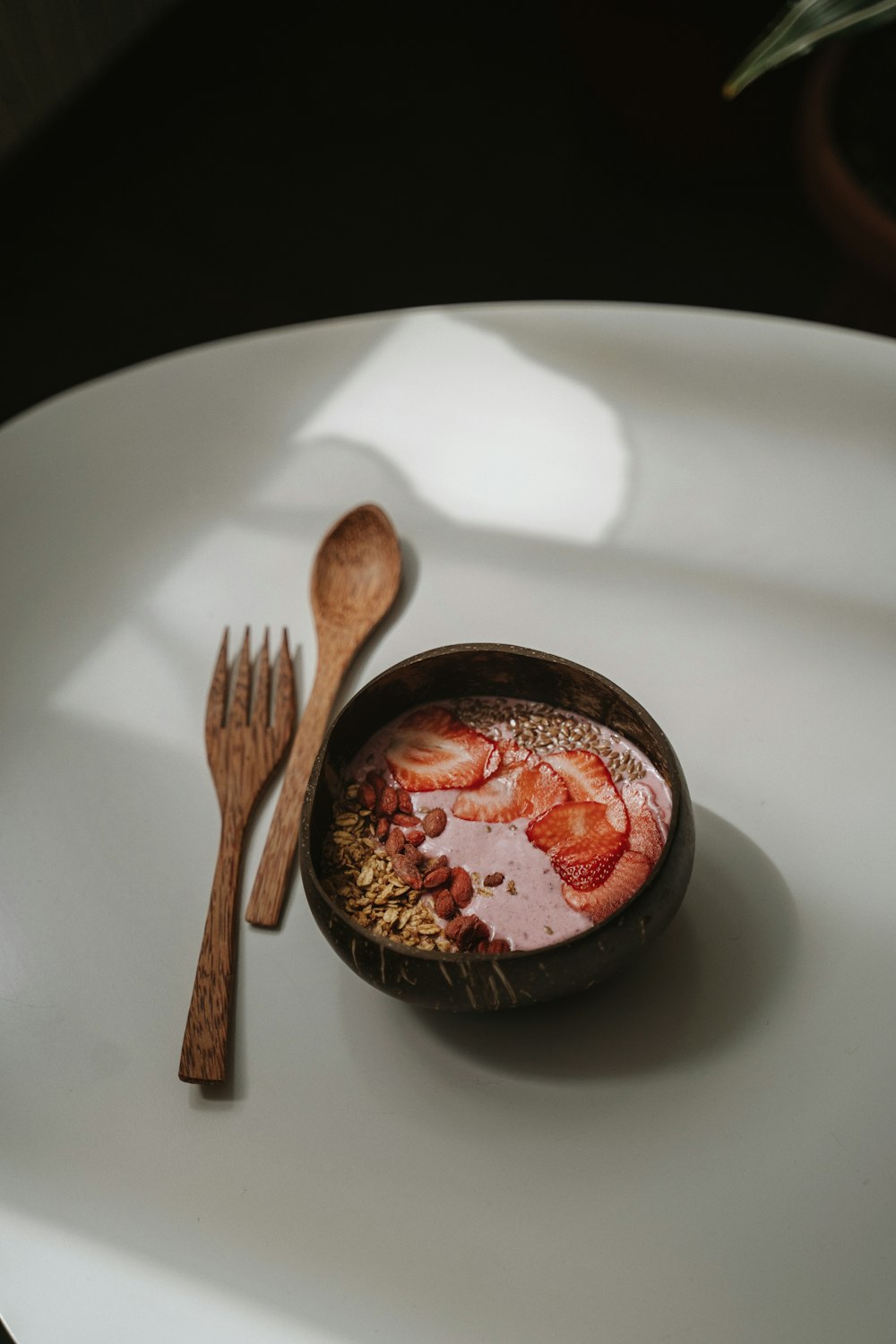 brown wooden spoon on white ceramic plate