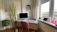 A sleek, modern executive desk set in a bright, cozy home office.