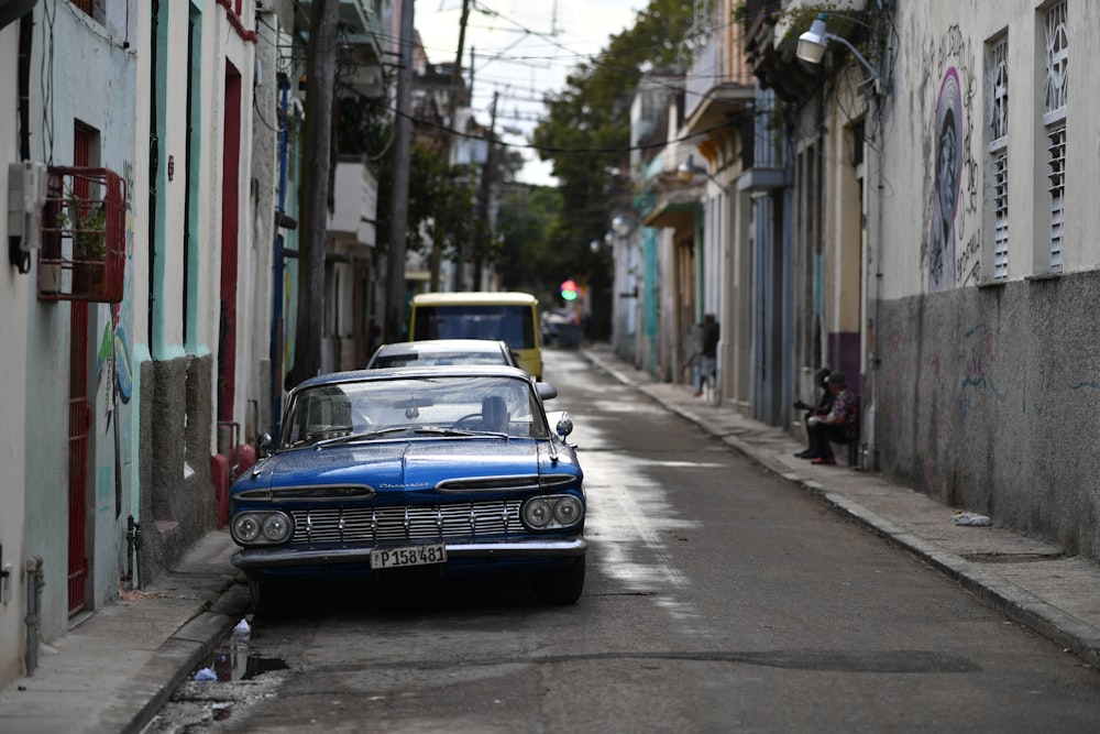 blue car on road during daytime