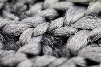 Close-up of tightly woven fiberglass cloth with a subtle sheen.