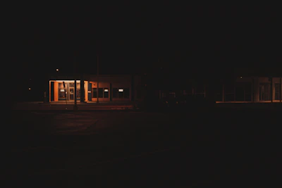 Evening scene of the gym’s entrance illuminated against the dark theme backdrop.