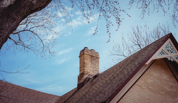 brown brick building under blue sky during daytime