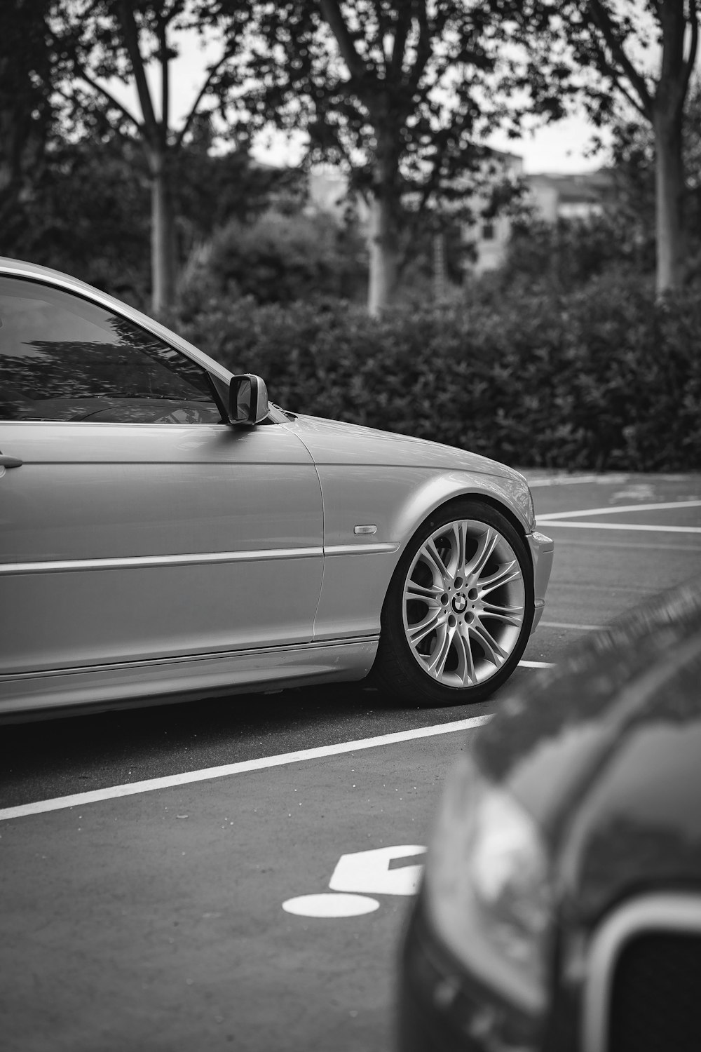 grayscale photo of car on road