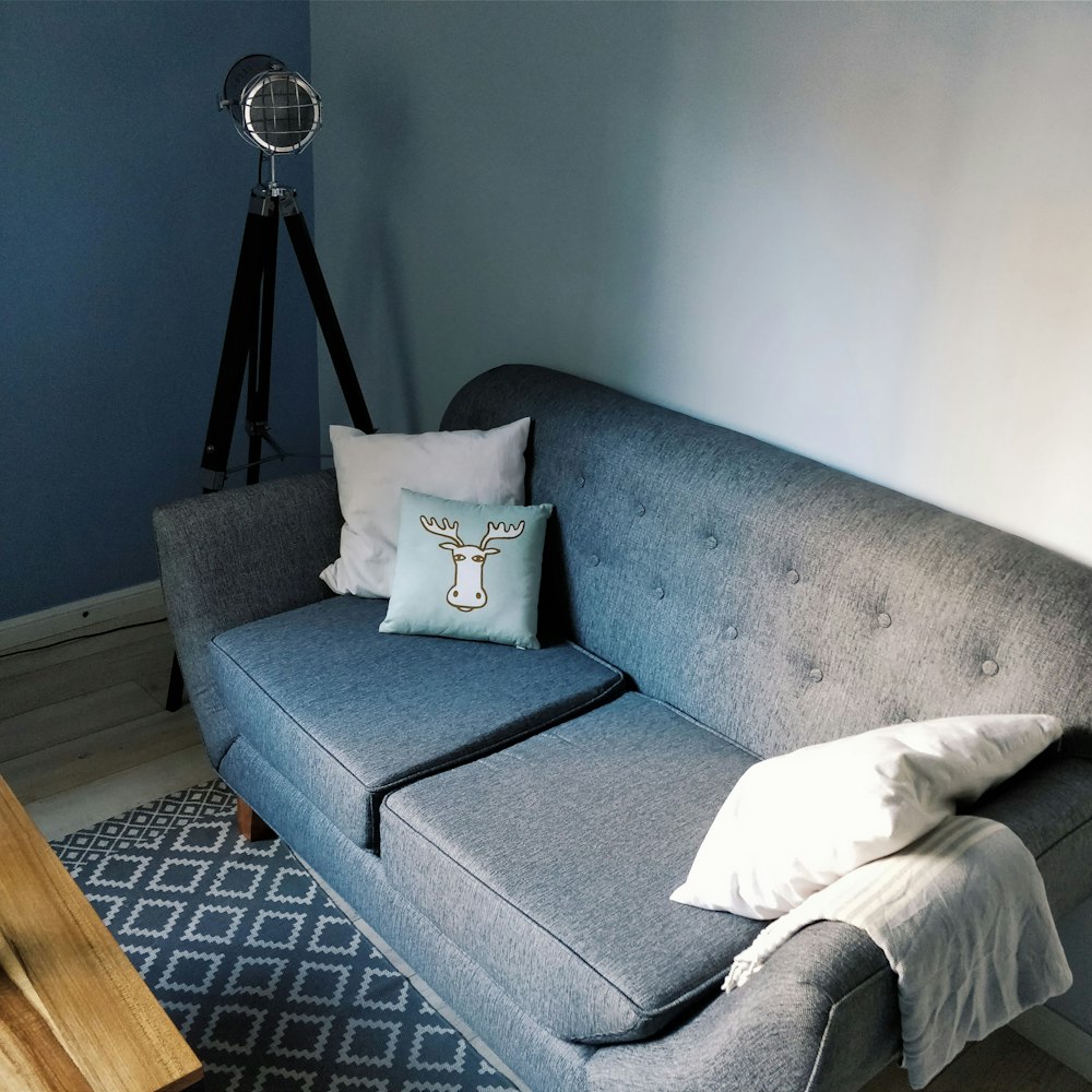 white throw pillow on gray couch