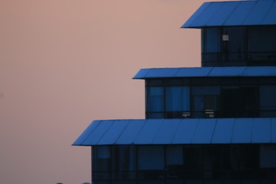 The modern Primaya hospital building glowing softly at dusk in Depok.