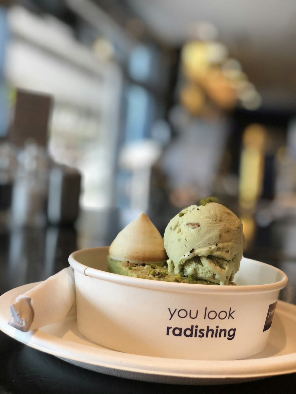 green ice cream in white ceramic bowl