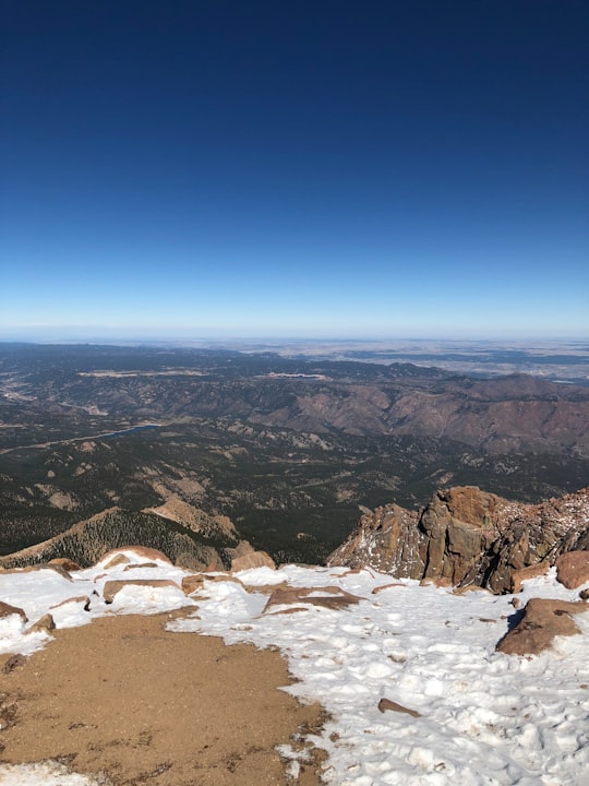 brown and white mountains under blue sky during daytime in Pikes Peak United States