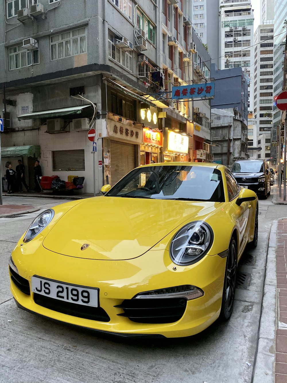 yellow ferrari 458 italia parked on street during daytime