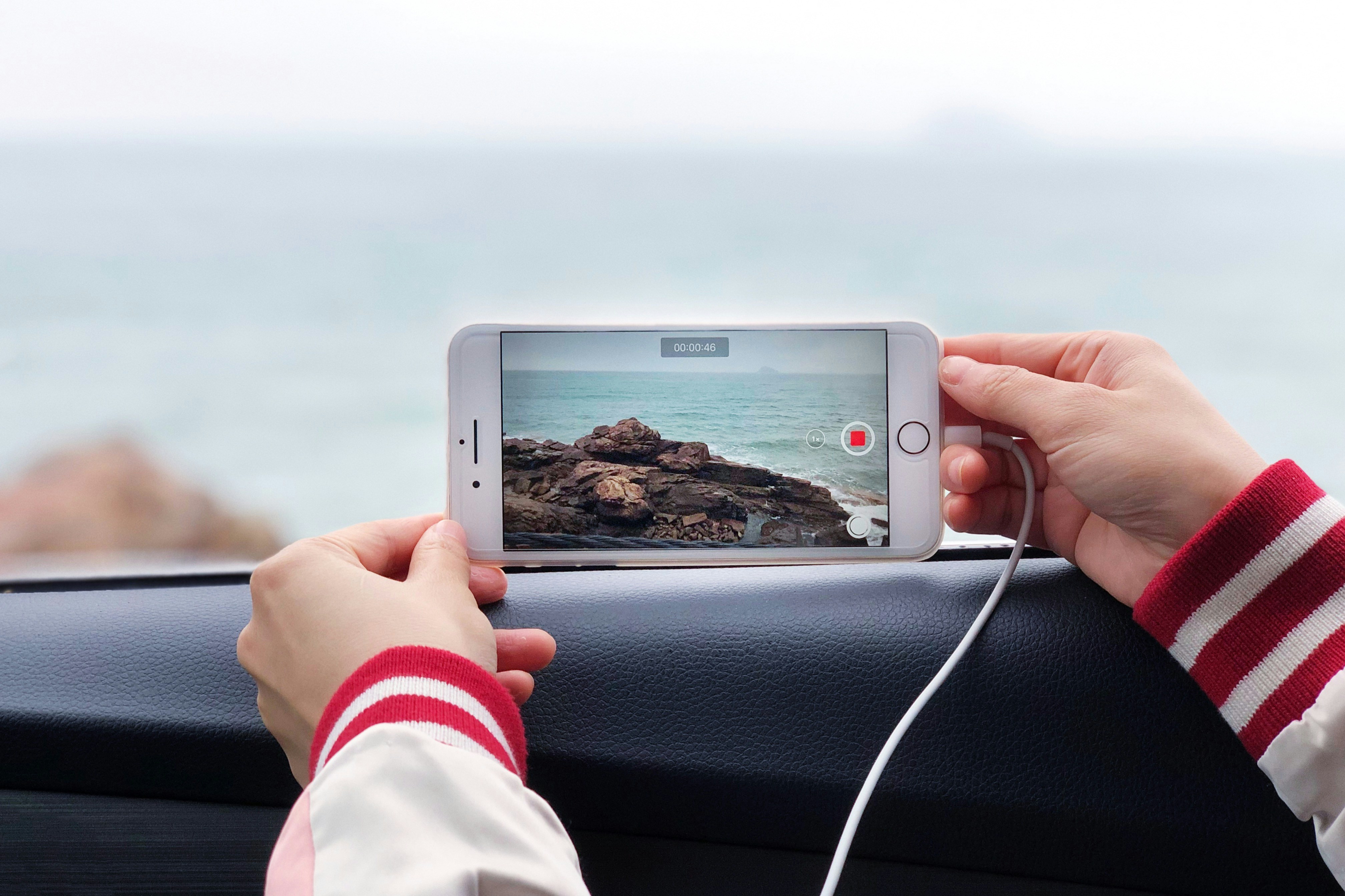 person holding silver iphone 6