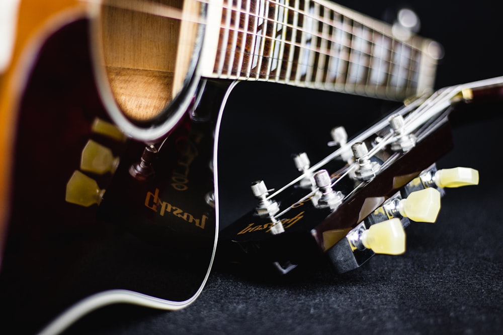 black and brown acoustic guitar