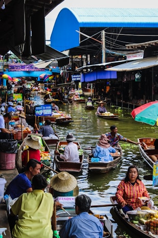 people riding on boat on river during daytime