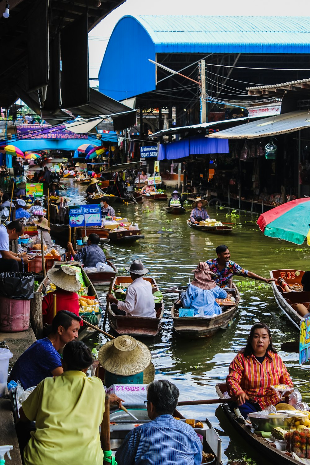 people riding on boat on river during daytime