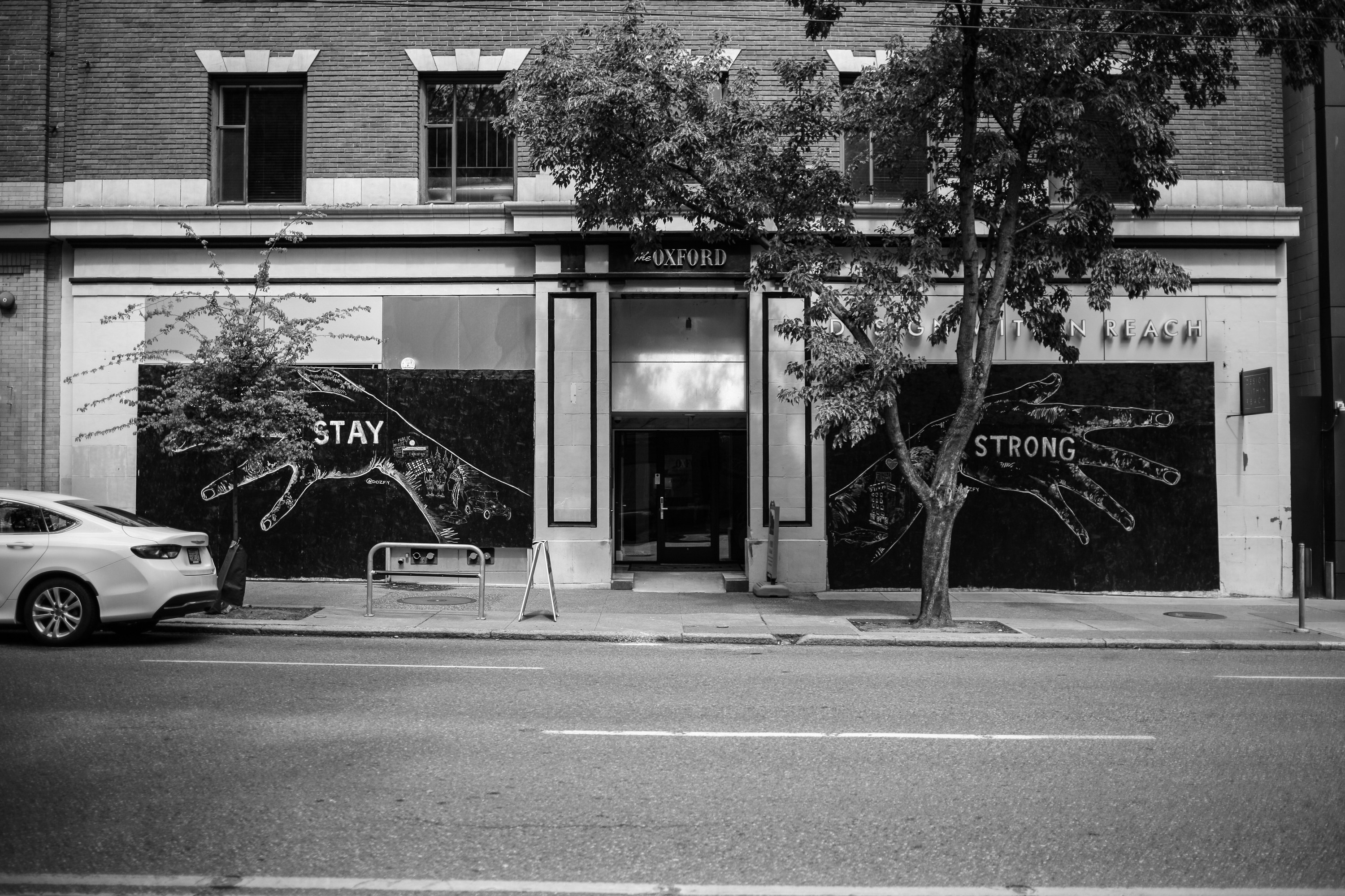 grayscale photo of store front
