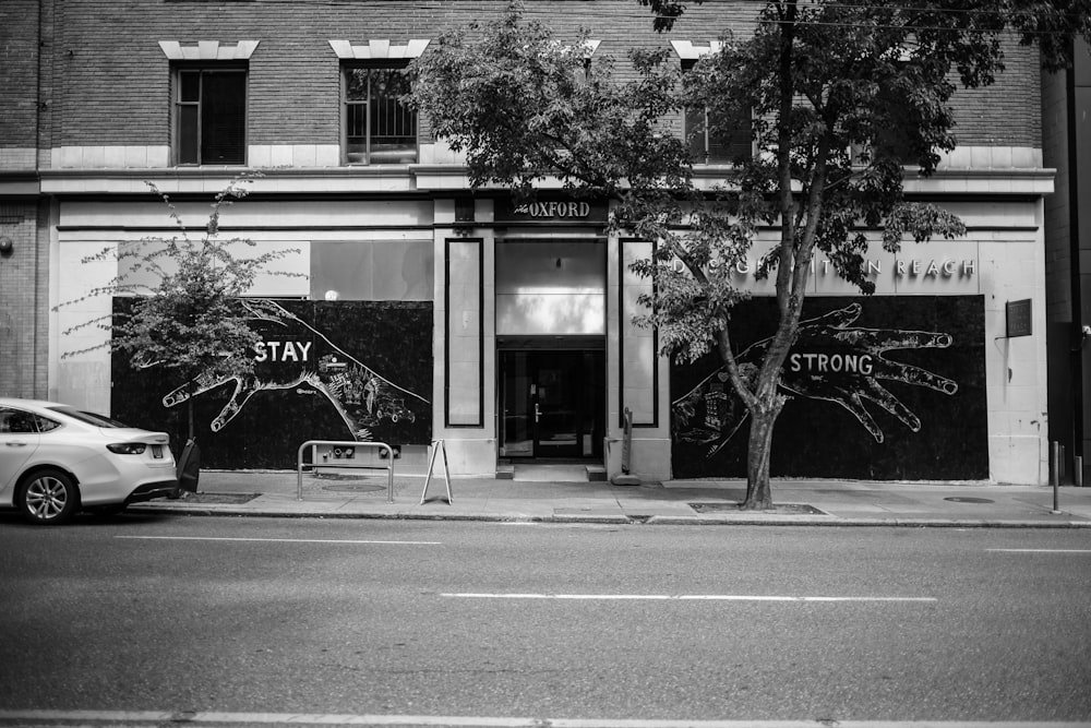 grayscale photo of store front