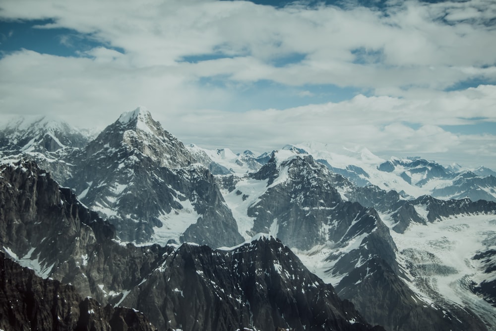 snow covered mountain under blue sky during daytime