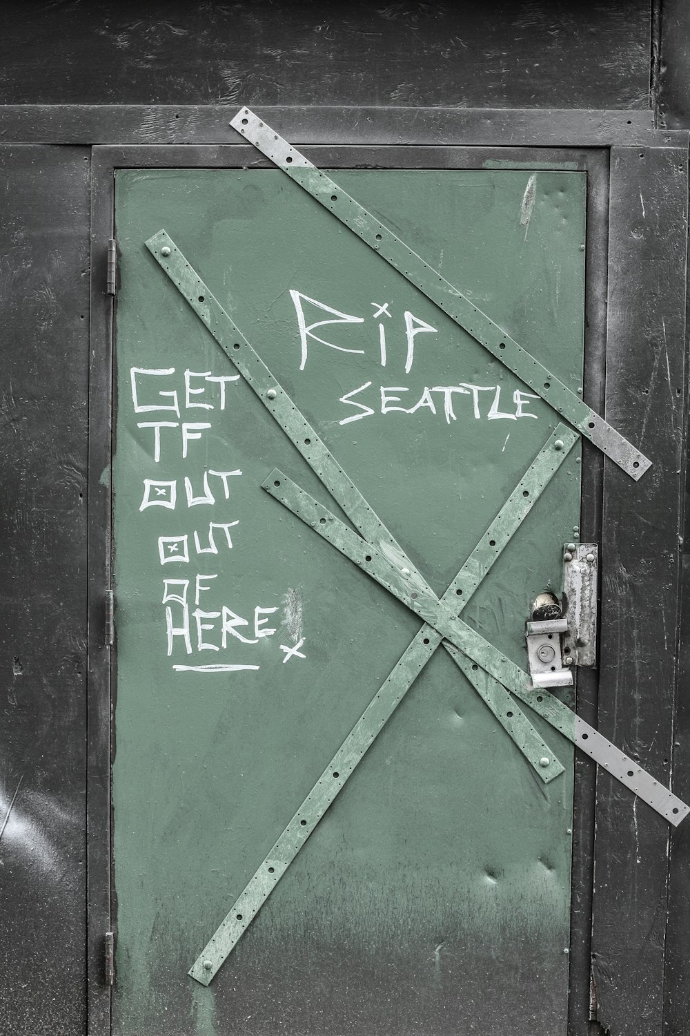 green and black metal door